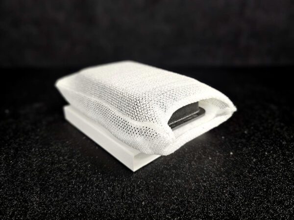 Against a dark background, the FF-5 for 5/8″ (1.58 CM) TO 1-1/4″ (3.2 CM) lies partially open, revealing its gray cover and a white base underneath, wrapped in a textured white cloth.