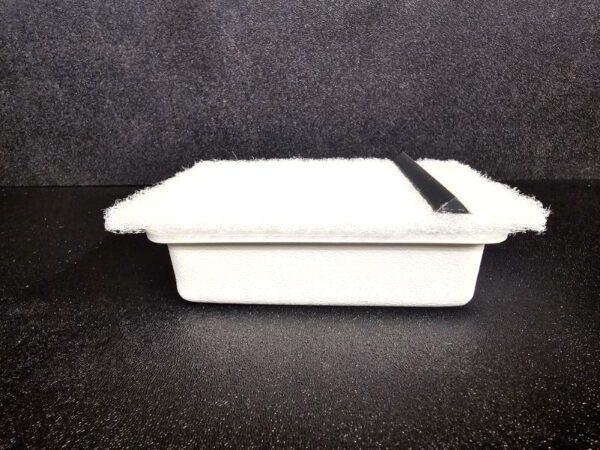 A closed white foam takeout container