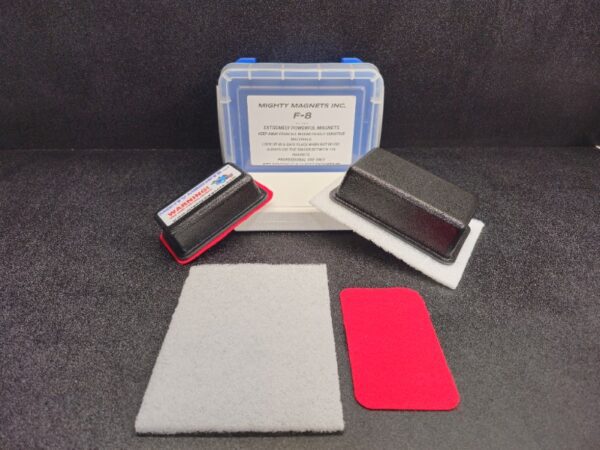 A plastic case labeled "F-6 for 1″ (2.5 cm) to 1-1/2″ (3.8 cm)" contains two rectangular magnets, one gray and one red felt pad, and a white cleaning pad.
