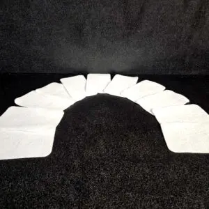 A curved arrangement of ten Scrub Pads (A) is displayed against a black background.