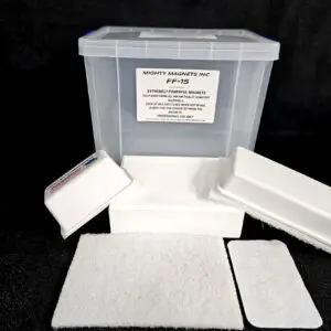 A clear plastic container labeled "FF-5 for 5/8″ (1.58 CM) TO 1-1/4″ (3.2 CM)" with multiple white foam pads and a white textured pad in front of it, all on a black background.