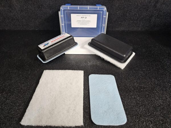Image of a folded filter material box labeled "FF-3 for 3/8″ (.95 CM) TO 3/4″ (1.9 CM)" with two black rectangular filter holders and three filter pads (white and light blue) placed in front against a dark background.