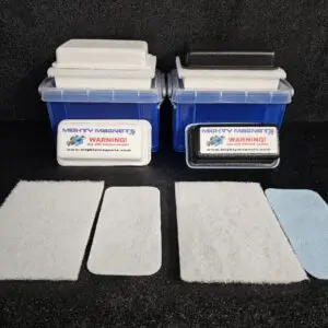 Two blue containers with labels and various rectangular pads in front of them are displayed against a black background. Text on the containers read, "FF-3 for 3/8″ (.95 CM) TO 3/4″ (1.9 CM) - WARNING!" and a website URL.