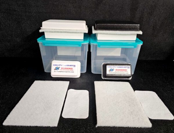 Two blue plastic containers with white and black foam pads on top. Each container has a labeled warning sign. Additionally, two rectangular and two square foam pieces are placed in front of the containers. Product Name: FF-5 for 5/8″ (1.58 CM) TO 1-1/4″ (3.2 CM).