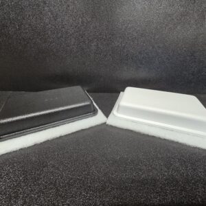 Black and white rectangular containers on display.